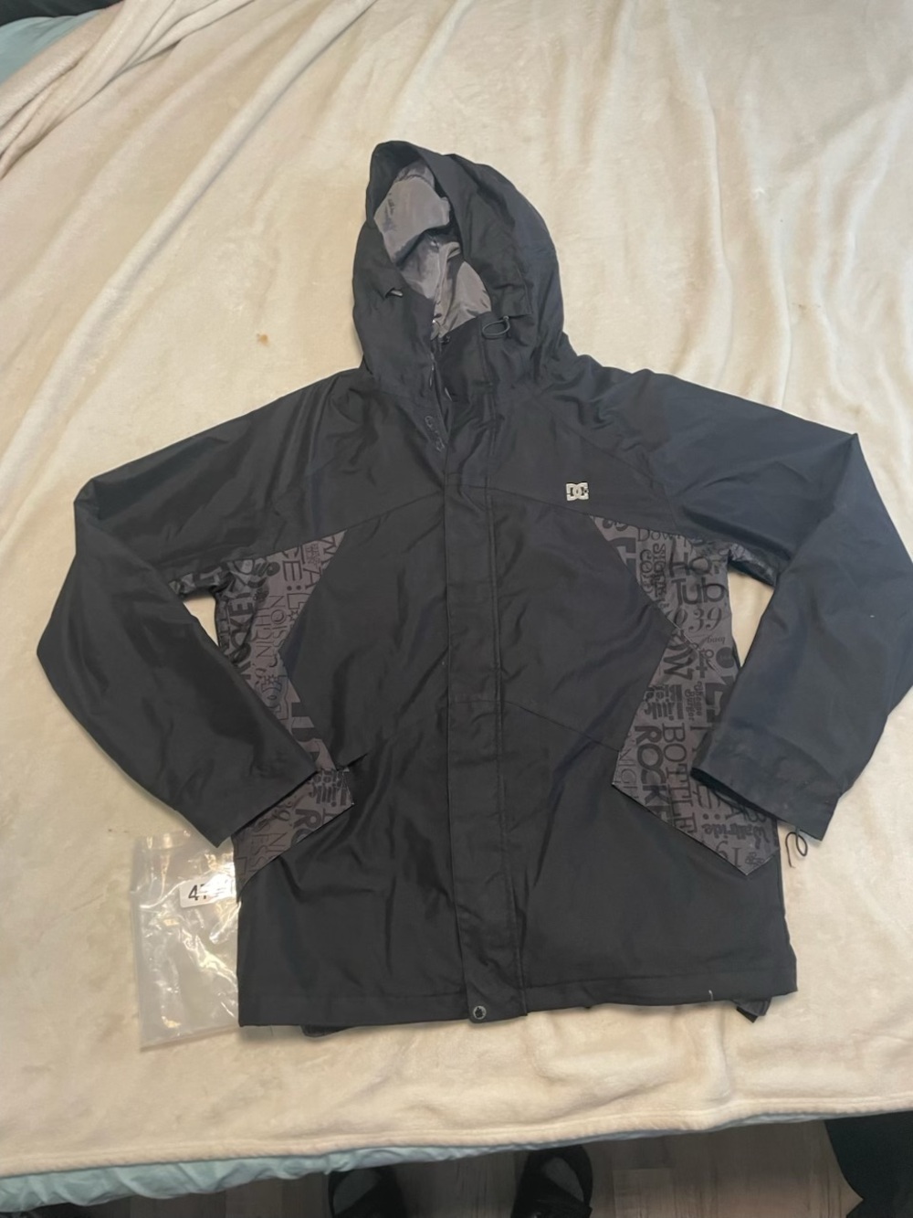 DC Boys' Black Hooded Rain Jacket with Patterned Panels